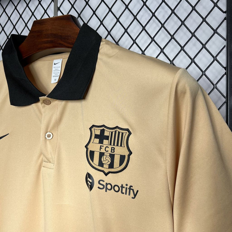 Camisa Barcelona Viagem Gold 24/25 - POLO